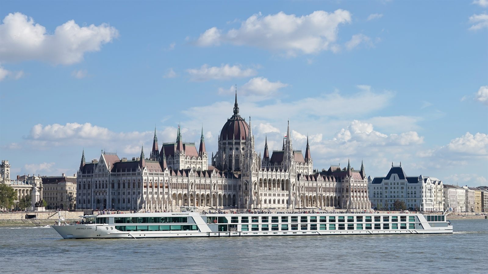 River cruise ship passing the Hungarian Parliament on the Danube in Budapest