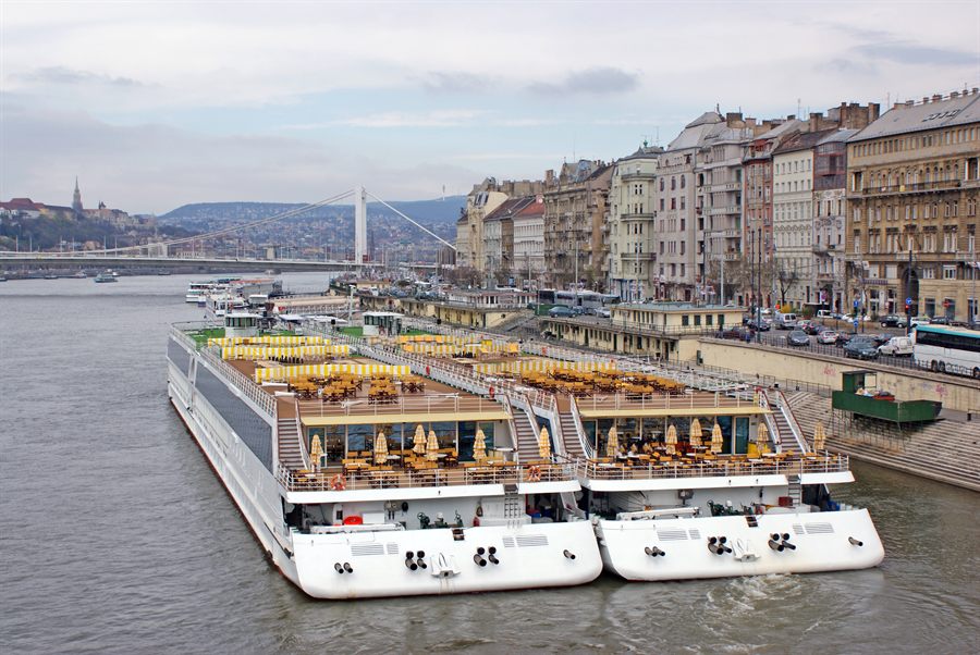Two river cruise ships moored side by side on the Danube in Budapest